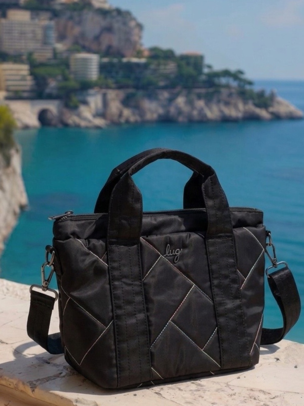 NWOT Lug Dory Mini Crossbody Bag, midnight black with rainbow stitching detail.